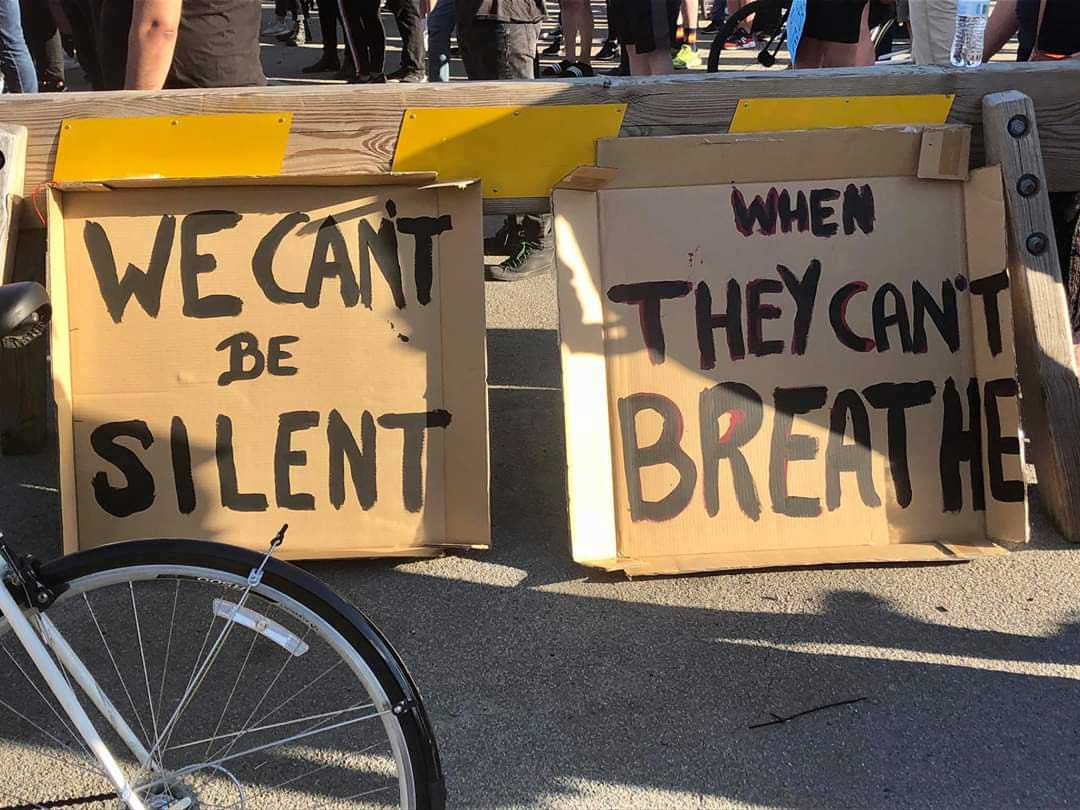 Protest Signs saying " We can't be silent when they can't breathe"